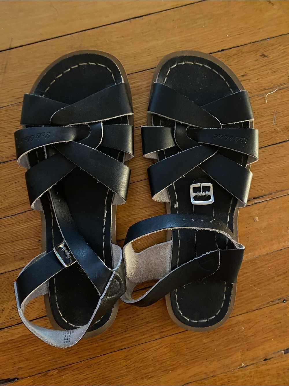 Salt Water Black Strappy Sandals that can go in the sea.